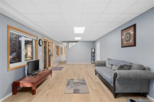 a living room with furniture and a window