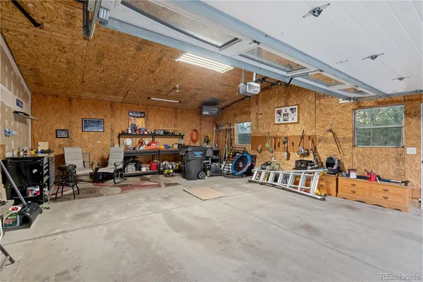 a view of a garage with a bike and a car