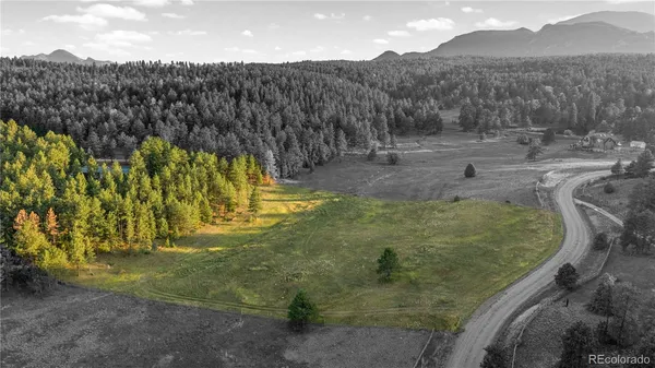 a view of a yard with mountains