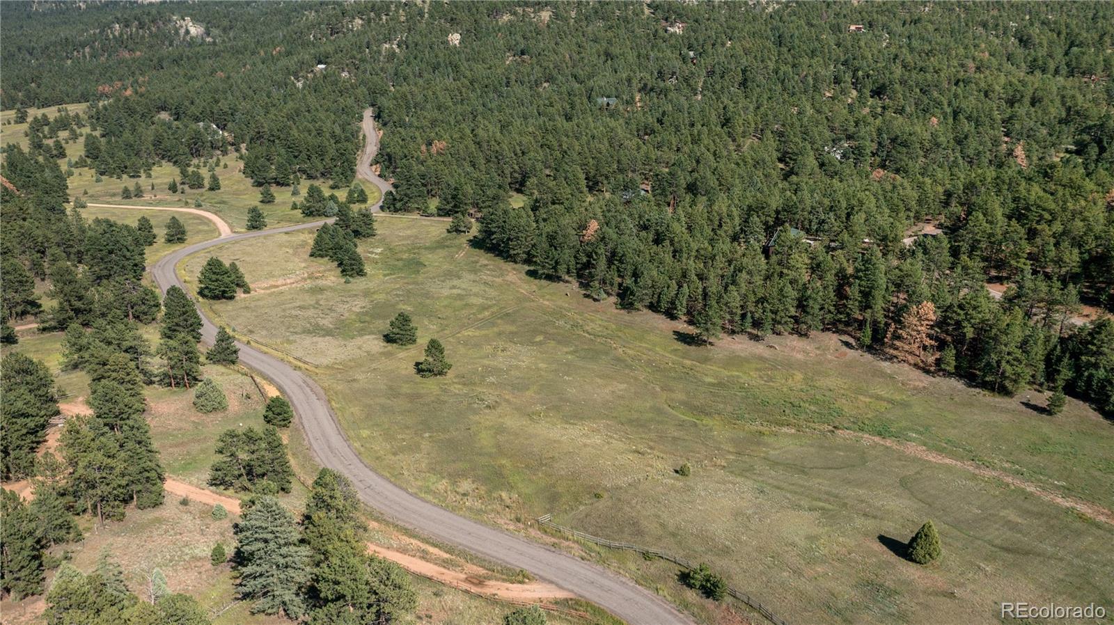 20065 Spring Creek Road Buffalo Creek, CO 80425 - Photo 40 of 41 a view of a backyard of a house