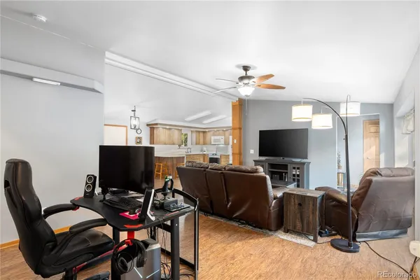 a view of a livingroom with workspace and a couch