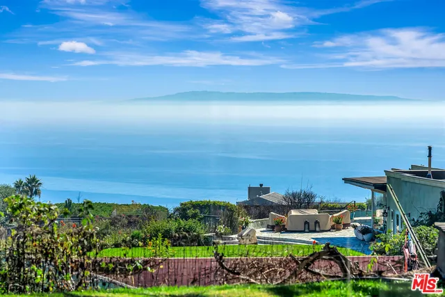 a view of a city with an ocean