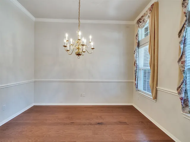 a kitchen with a sink a counter top space cabinets and stainless steel appliances