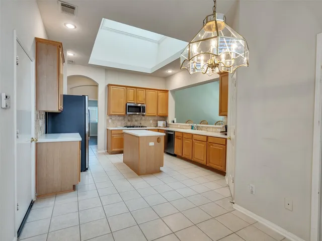 a bathroom with a sink a mirror and a shower