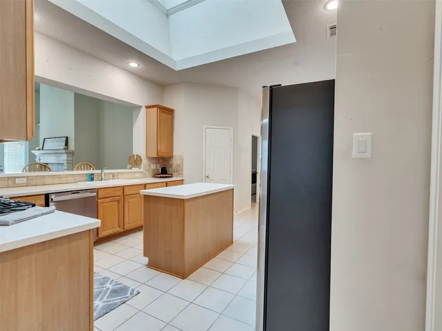 a view of an entryway with window and chandelier in a room