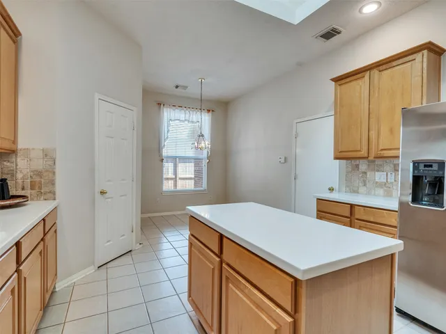 a bathroom with a tub sink shower and mirror