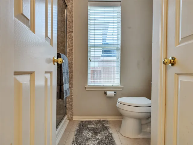 a view of a backyard with a garden and entertaining space