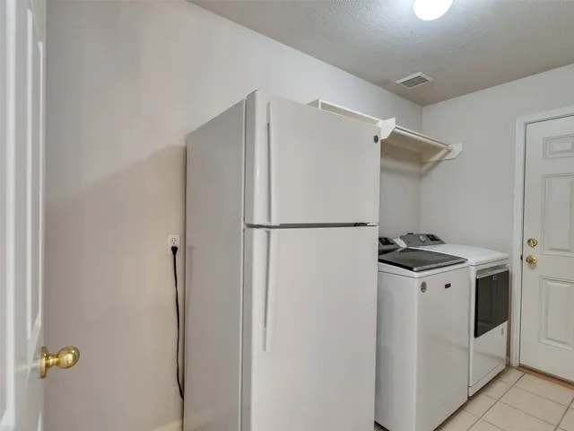 an aerial view of a house with a yard and garden