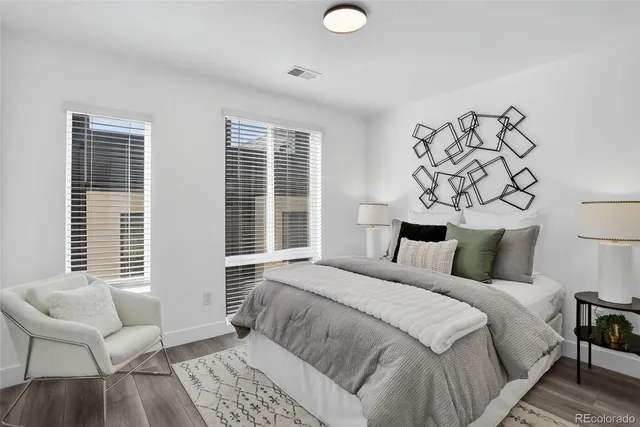 a bedroom with a bed and a couch