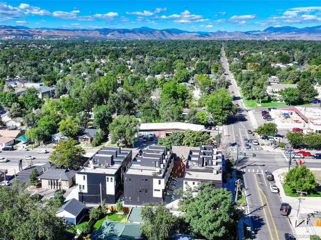 an aerial view of a house with a yard basket ball court and outdoor seating