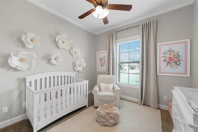 a bedroom with furniture and a large window