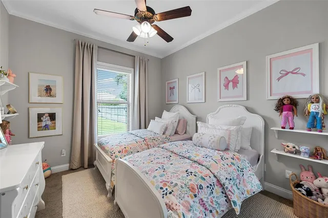 a bedroom with bed and a large window