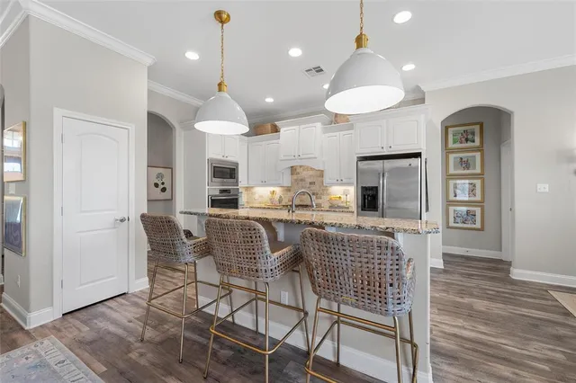 a view of kitchen and dining area with furniture