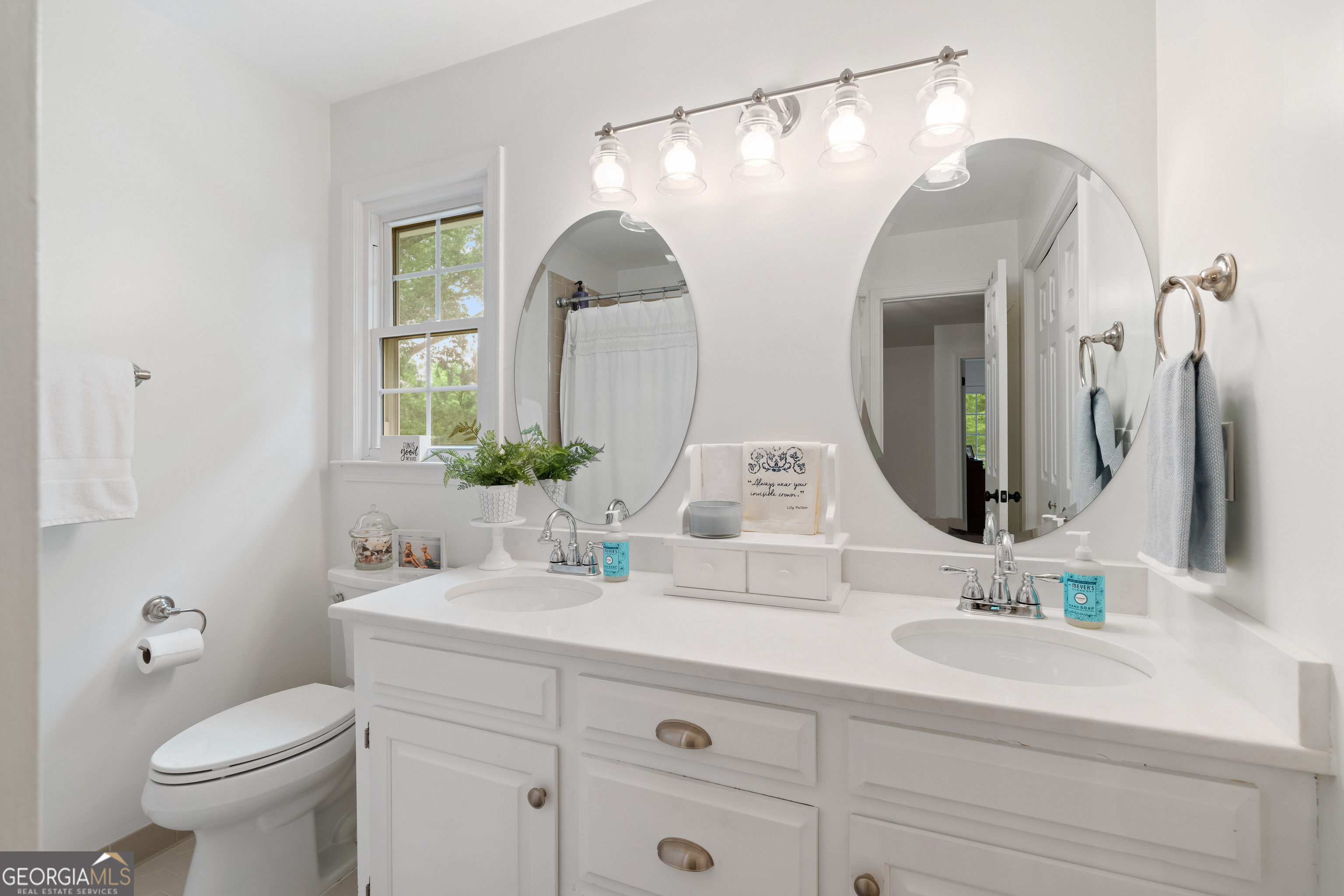 836 Oak Grove Road Carrollton, GA 30117 - Photo 39 of 50 a bathroom with a double vanity sink and a mirror