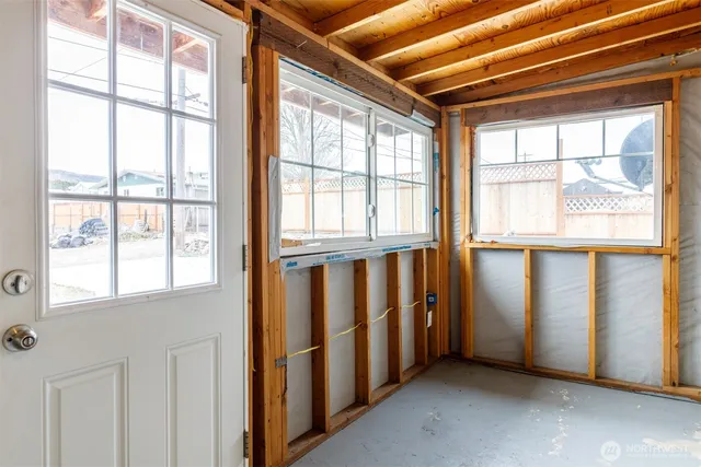 a view of a room with wooden walls