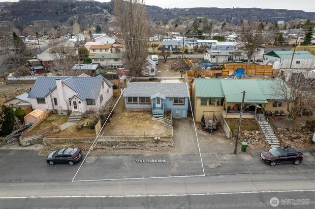 an aerial view of houses with outdoor space