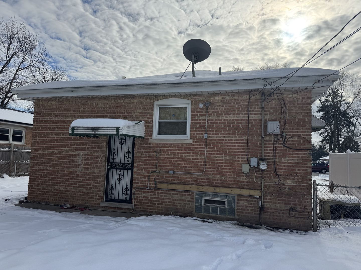 1104 East 156th Place Dolton, IL 60419 - Photo 12 of 14 a front view of a house with parking space