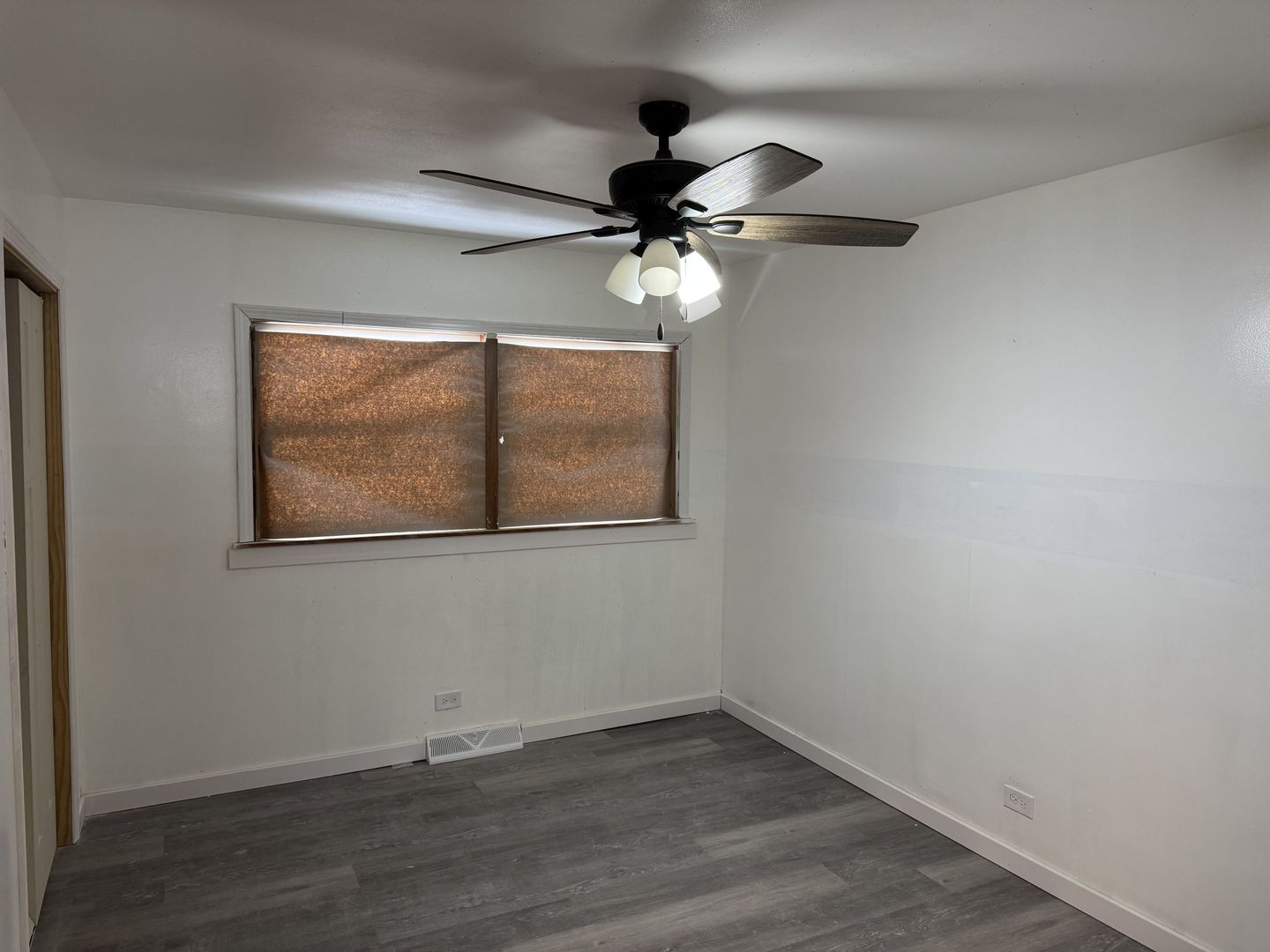 1104 East 156th Place Dolton, IL 60419 - Photo 3 of 14 a view of an empty room with a window