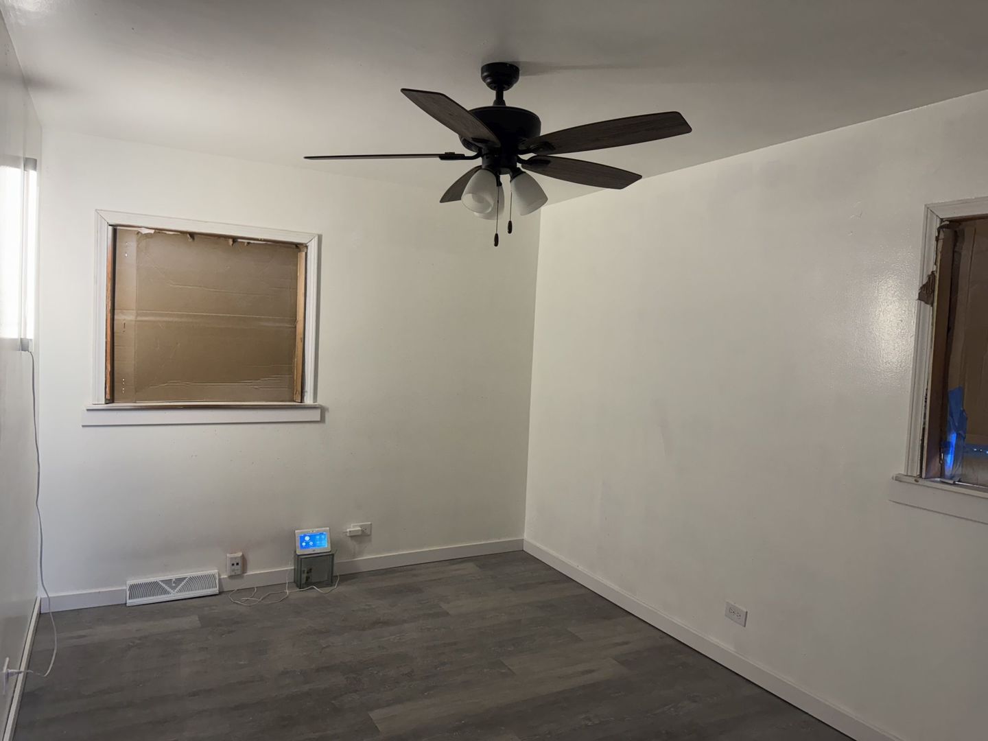 1104 East 156th Place Dolton, IL 60419 - Photo 6 of 14 a view of an empty room with a window