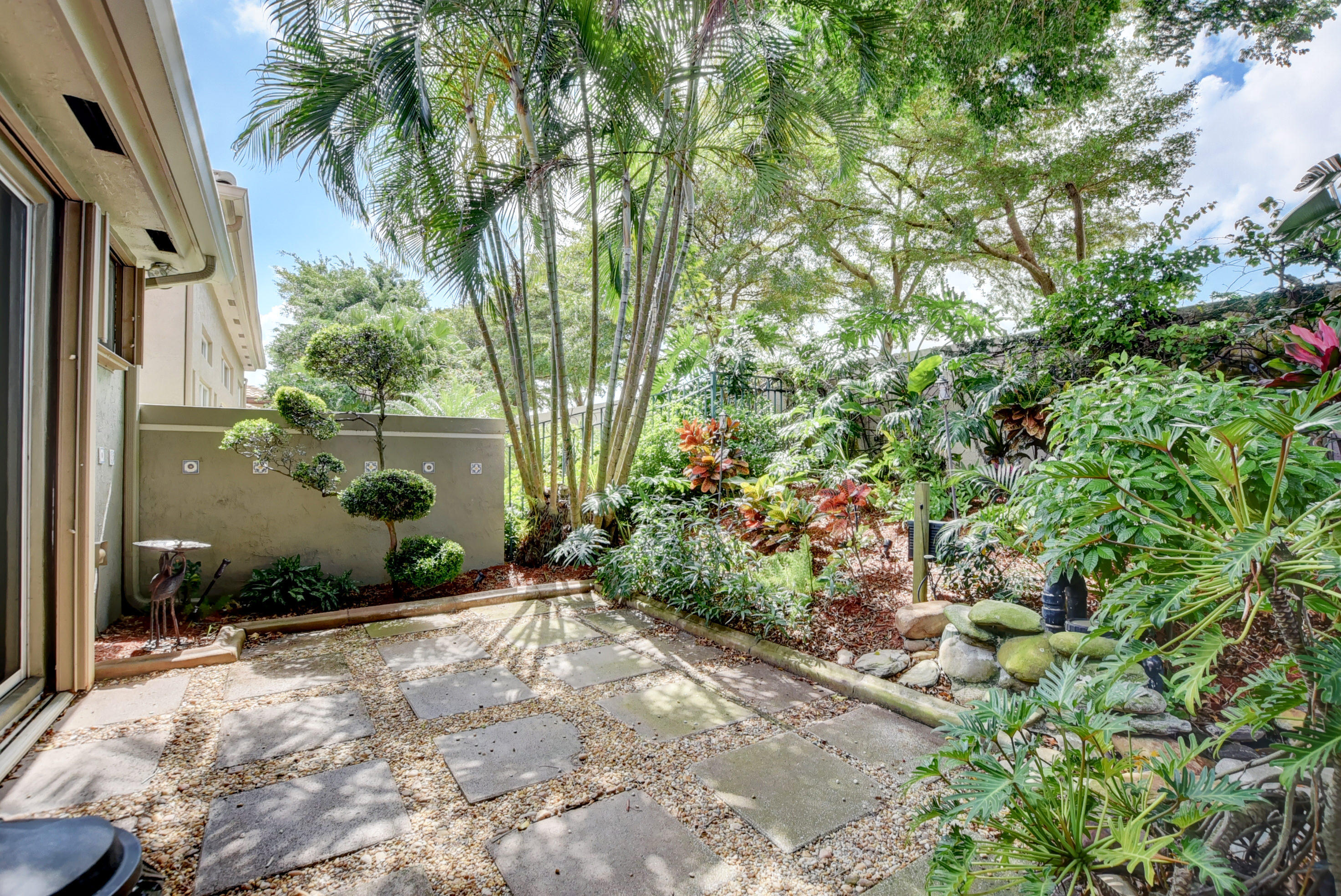 6342 Northwest 23rd Street Boca Raton, FL 33434 - Photo 19 of 50 Seating area by waterfall and pond