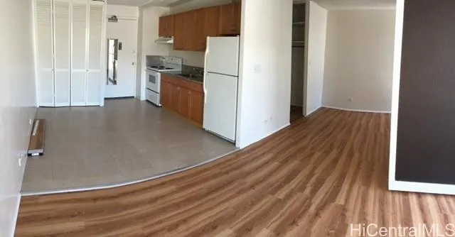 a view of a kitchen from the hallway