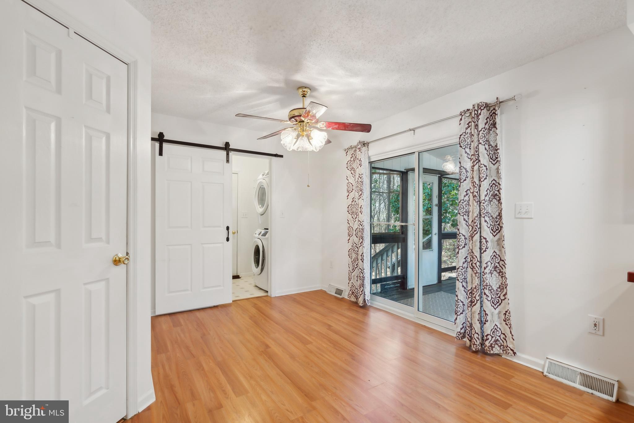 14 Skyline Drive Sicklerville, NJ 08081 - Photo 12 of 25 a very nice looking room with a chandelier fan and a window