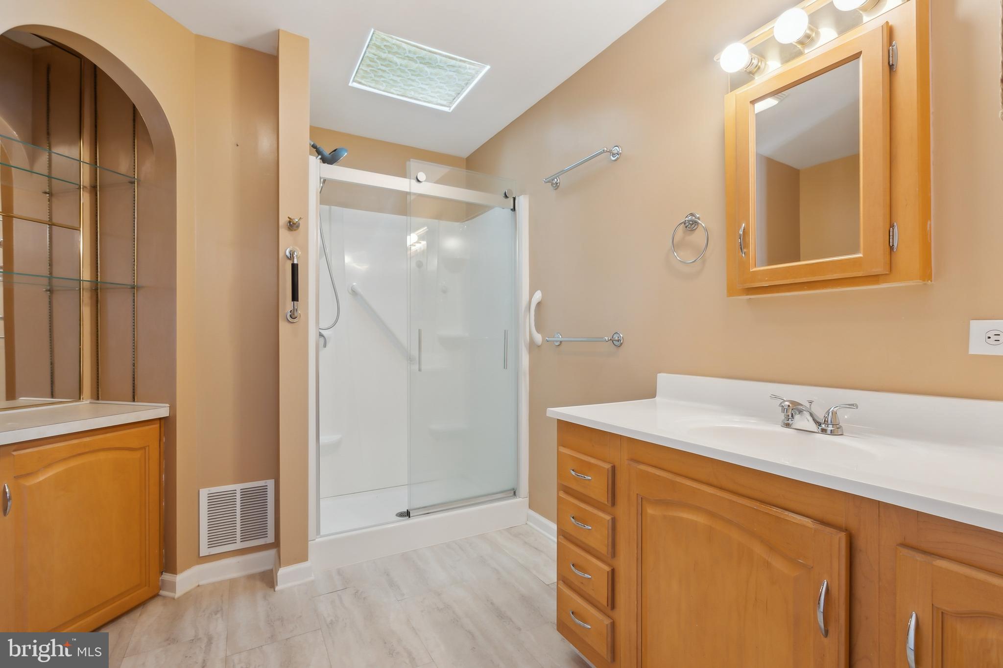 14 Skyline Drive Sicklerville, NJ 08081 - Photo 16 of 25 a bathroom with a sink and a mirror