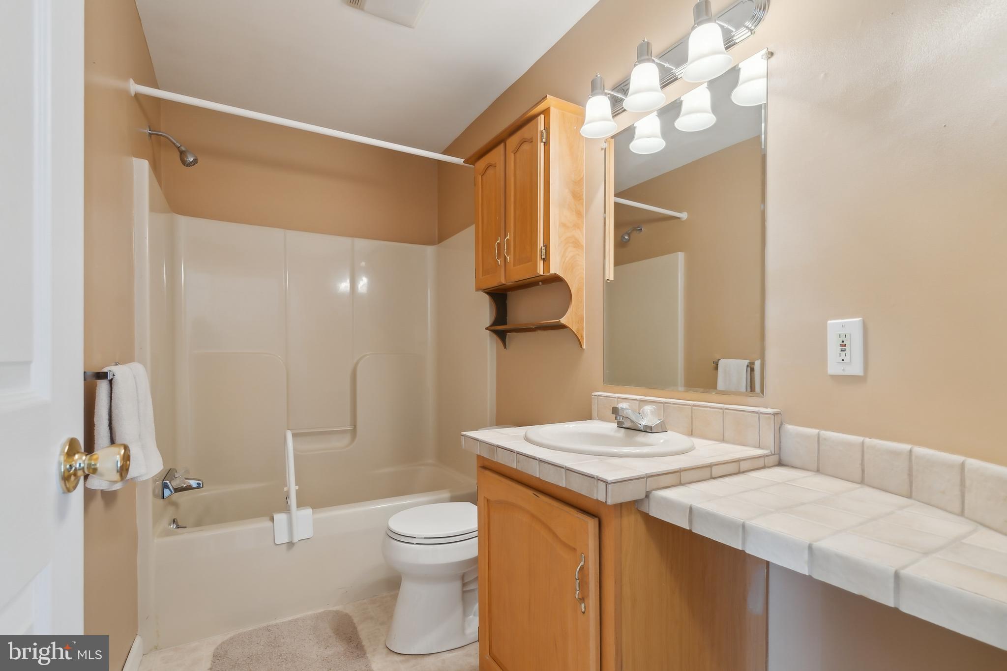 14 Skyline Drive Sicklerville, NJ 08081 - Photo 20 of 25 a bathroom with a granite countertop sink toilet and shower