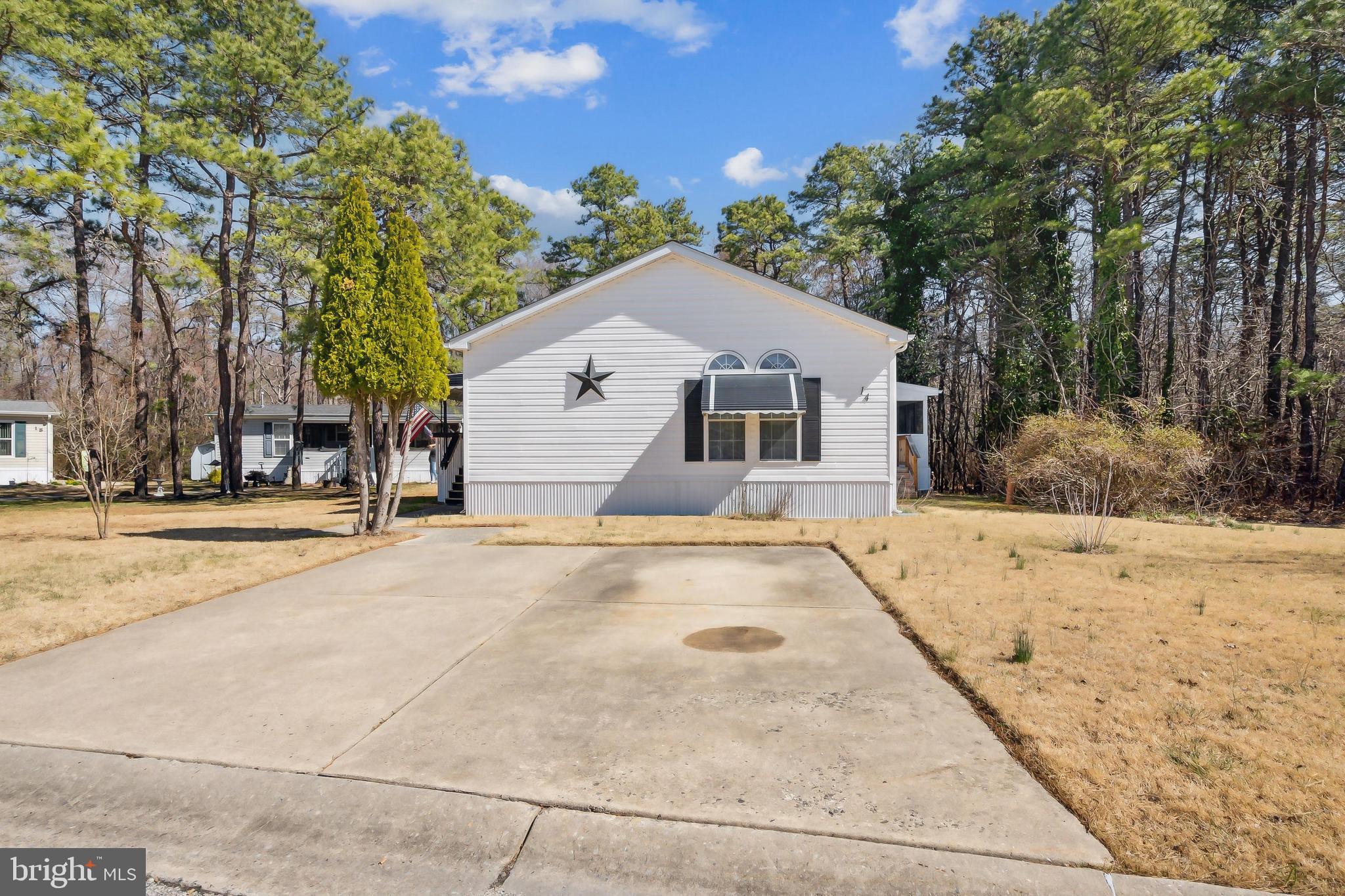 14 Skyline Drive Sicklerville, NJ 08081 - Photo 2 of 25 a view of a white house with a large tree with large trees