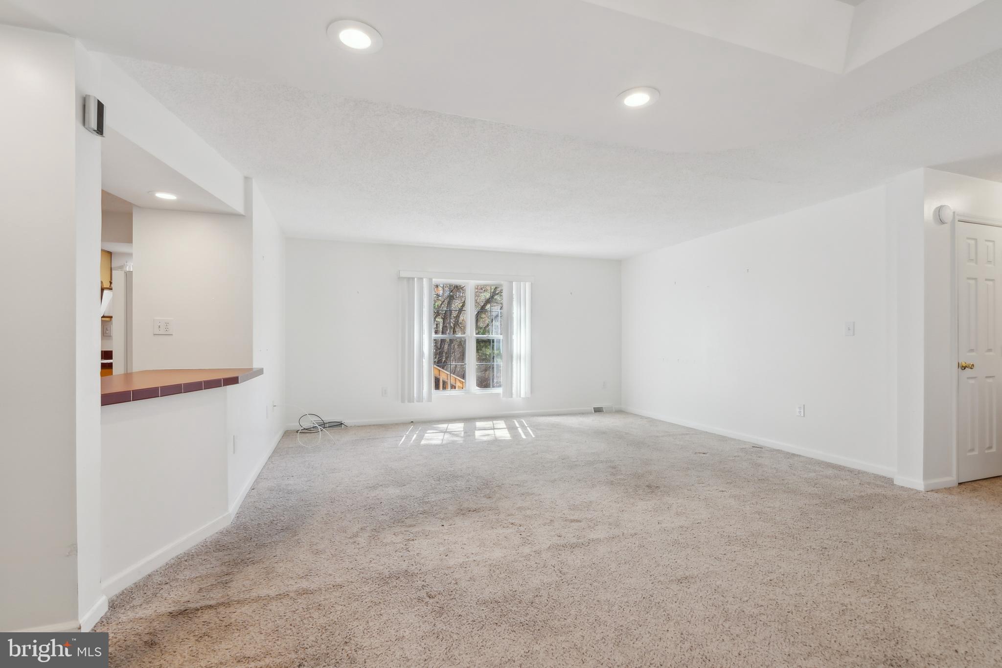 14 Skyline Drive Sicklerville, NJ 08081 - Photo 5 of 25 a view of an empty room with a window
