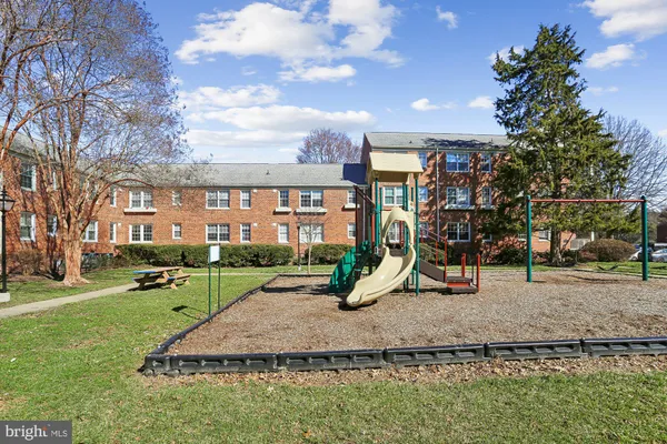 a view of a park with swings and slides