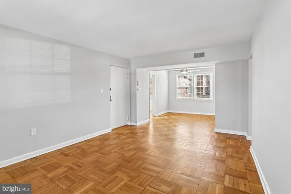 a view of an empty room with a window