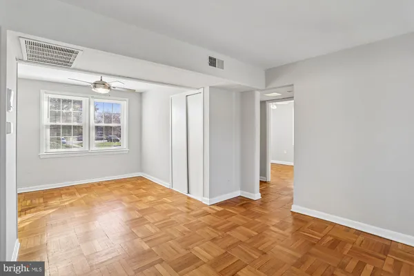 a view of an empty room with a window