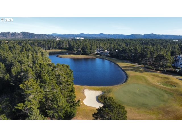 560 Tournament Drive Florence, OR 97439 - Photo 6 of 7 a view of a swimming pool with a garden