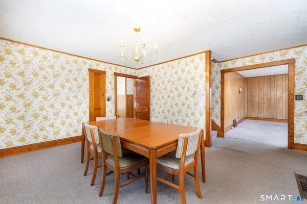 a dining room with furniture and window