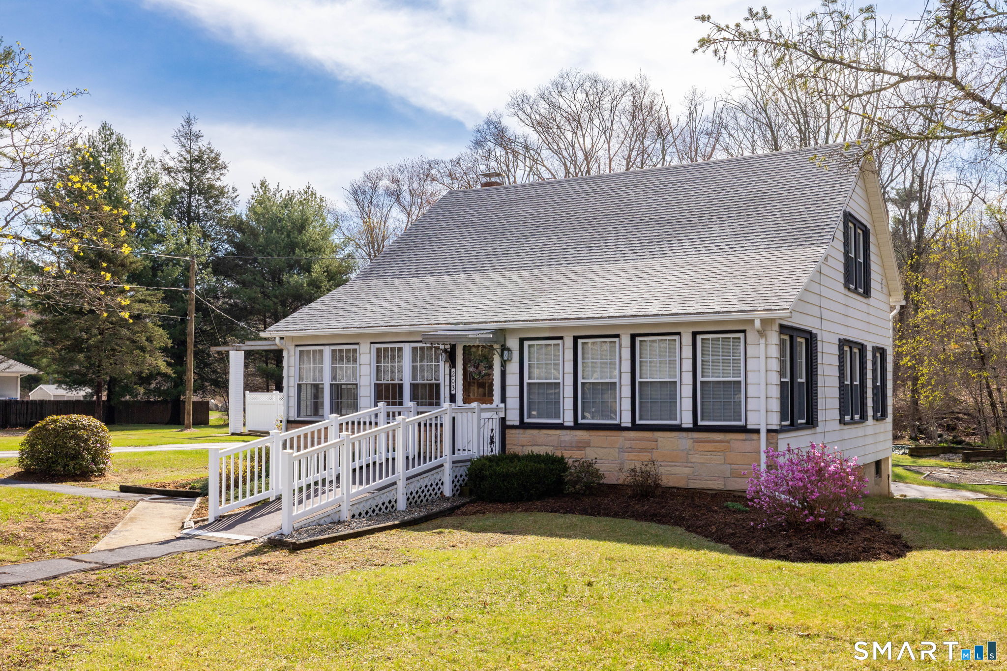 203 Willimantic Road Chaplin, CT 06235 - Photo 2 of 39 a view of a house with a yard patio and fire pit