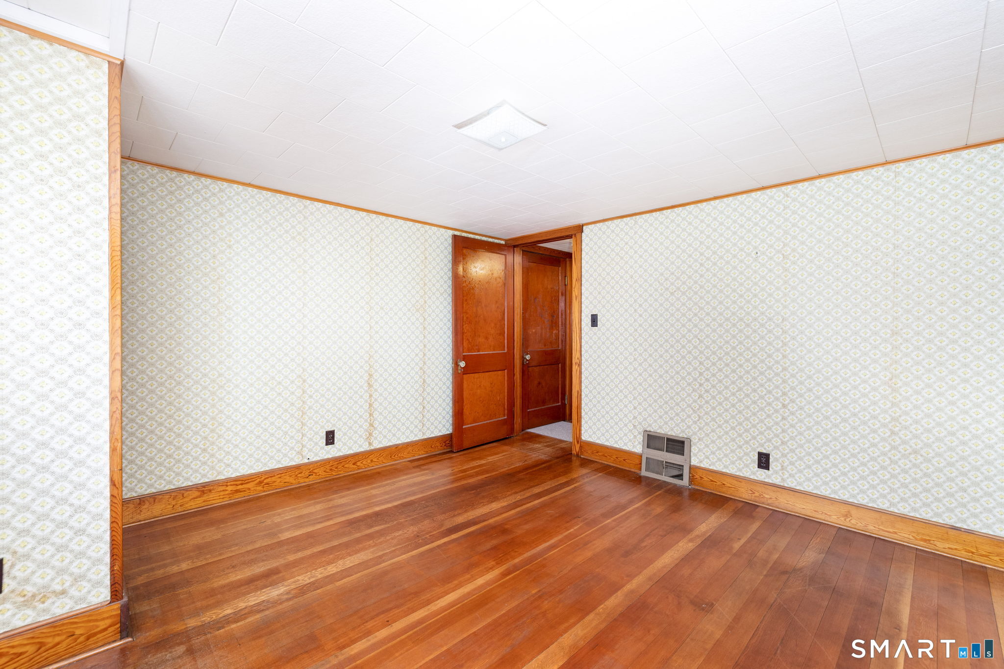 203 Willimantic Road Chaplin, CT 06235 - Photo 21 of 39 a view of an empty room with wooden floor