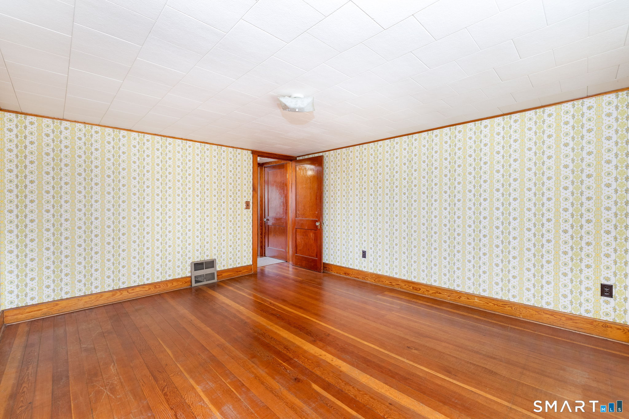 203 Willimantic Road Chaplin, CT 06235 - Photo 25 of 39 a view of an empty room with wooden floor