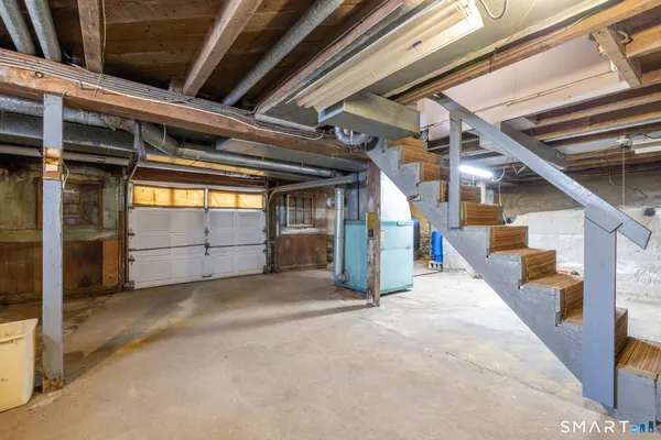 a view of an empty room with stairs