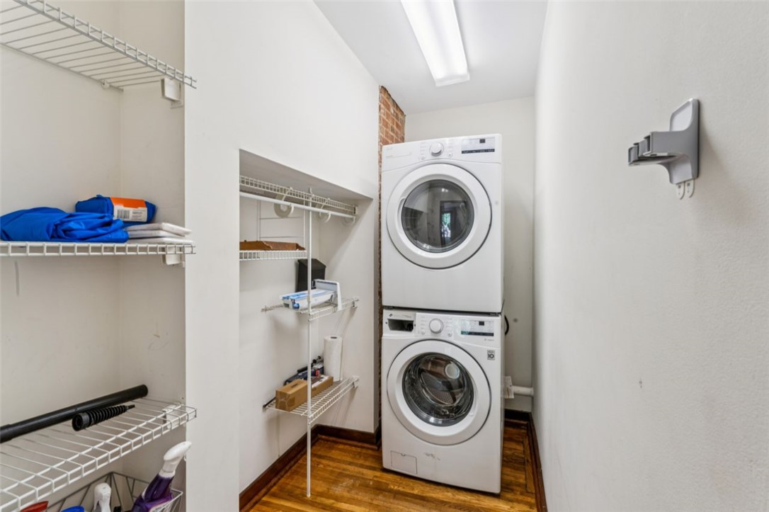 321 South Pine Street Walhalla, SC 29691 - Photo 4 of 32 Functional laundry space featuring convenient stacked appliances and built-in shelving for storage.