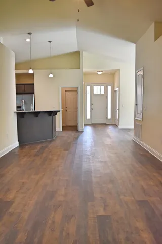 a view of a kitchen with a sink and a window