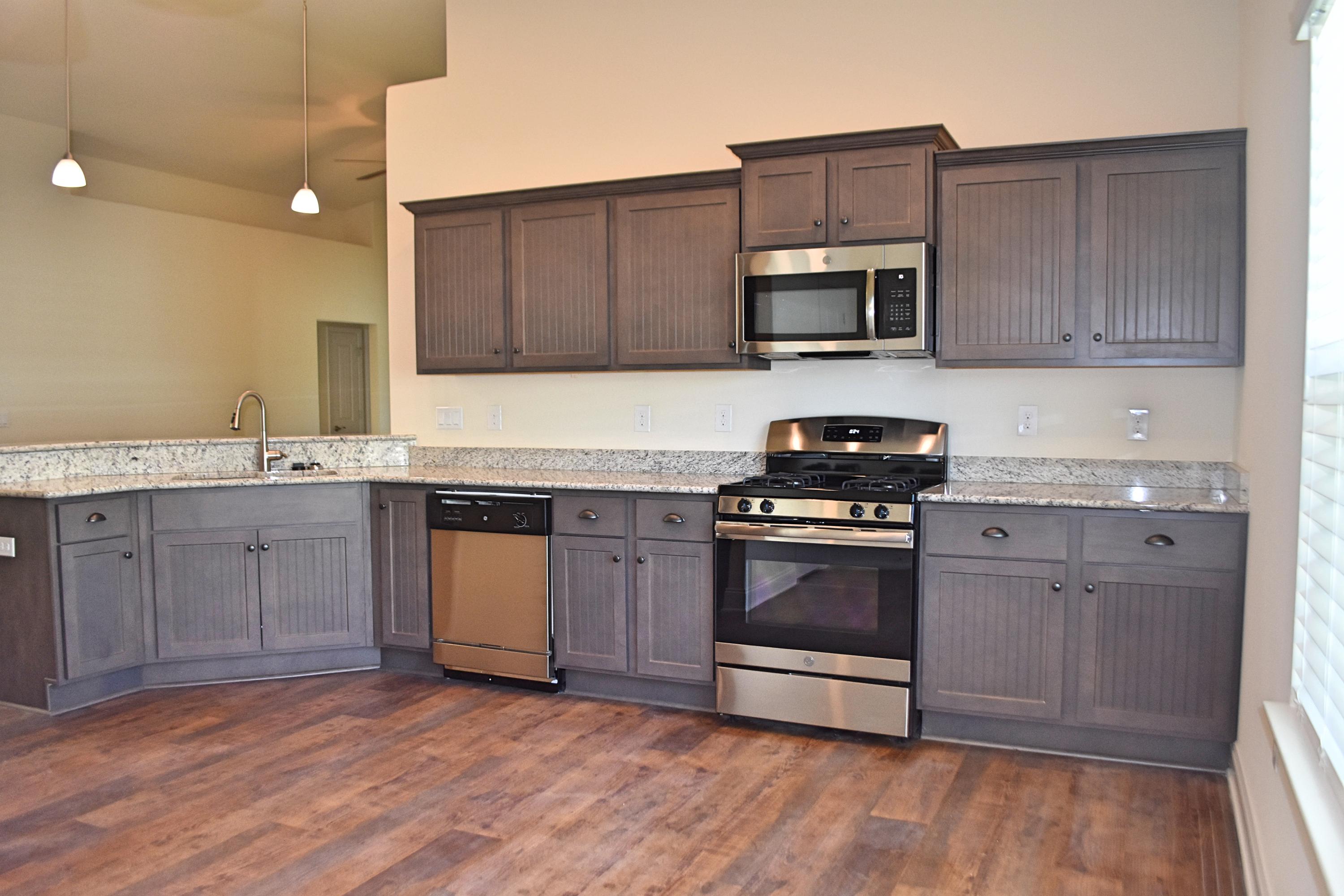211 Brandywine Road Freeport, FL 32439 - Photo 15 of 37 a kitchen with granite countertop a stove and a sink