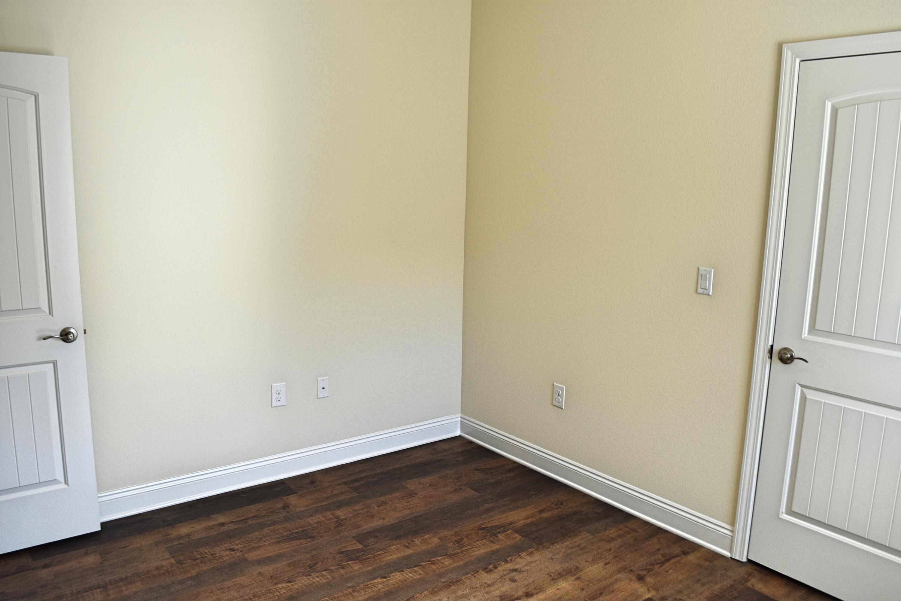 211 Brandywine Road Freeport, FL 32439 - Photo 23 of 37 a view of an empty room with wooden floor