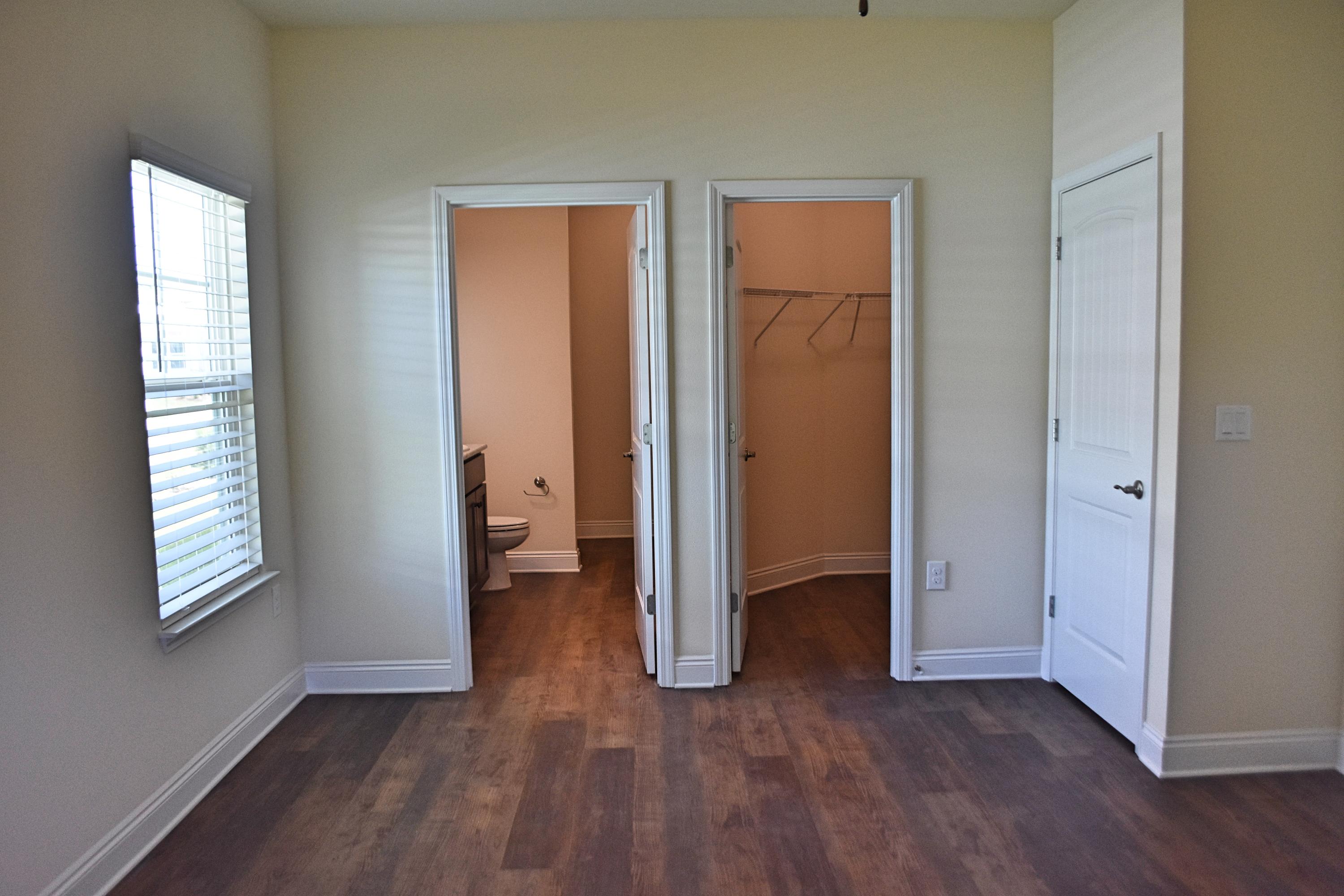 211 Brandywine Road Freeport, FL 32439 - Photo 29 of 37 an empty room with wooden floor and windows