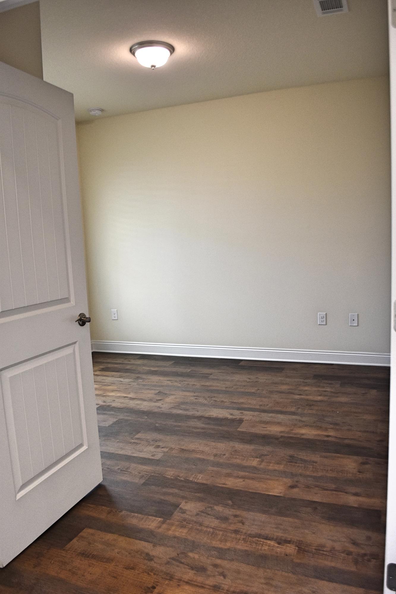 211 Brandywine Road Freeport, FL 32439 - Photo 6 of 37 a view of an empty room and wooden floor