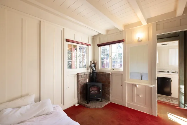 a bedroom with furniture and a fireplace