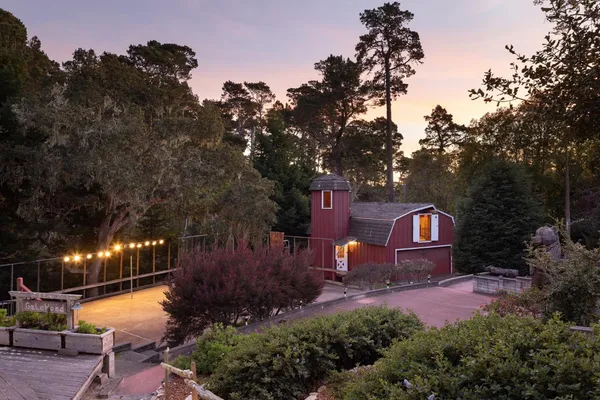 a backyard of a house with yard and outdoor seating