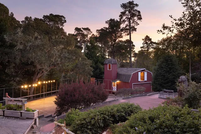 a backyard of a house with yard and outdoor seating