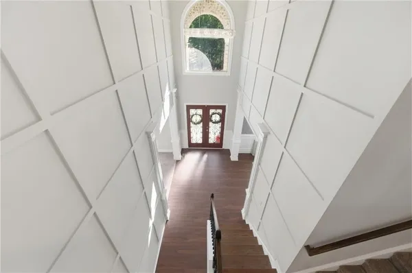 a view of entryway with wooden floor