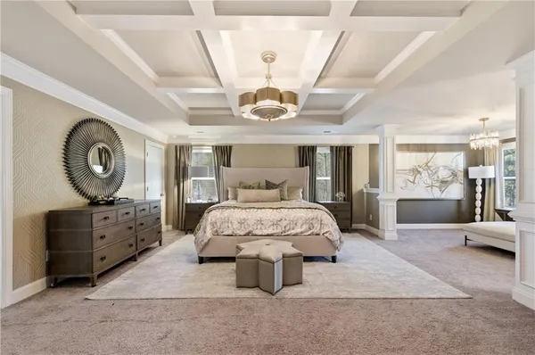 a spacious bedroom with a bed and window